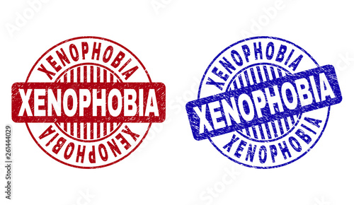 Grunge XENOPHOBIA round stamp seals isolated on a white background. Round seals with distress texture in red and blue colors.
