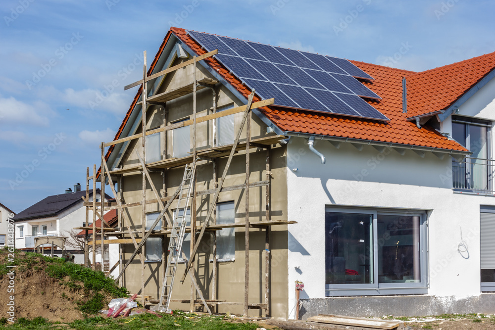 framing house with solar panels on rooftop framing house with solar panels on rooftop