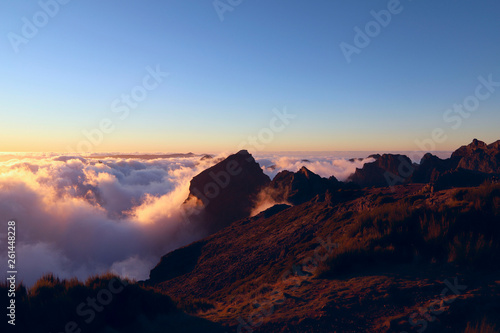 Sunset in the clouds at the height of the Pico do Arieiro on the island of Madeira. Portugal. Background, outdoors, nobody, horizontal. Concept of natural beauty.