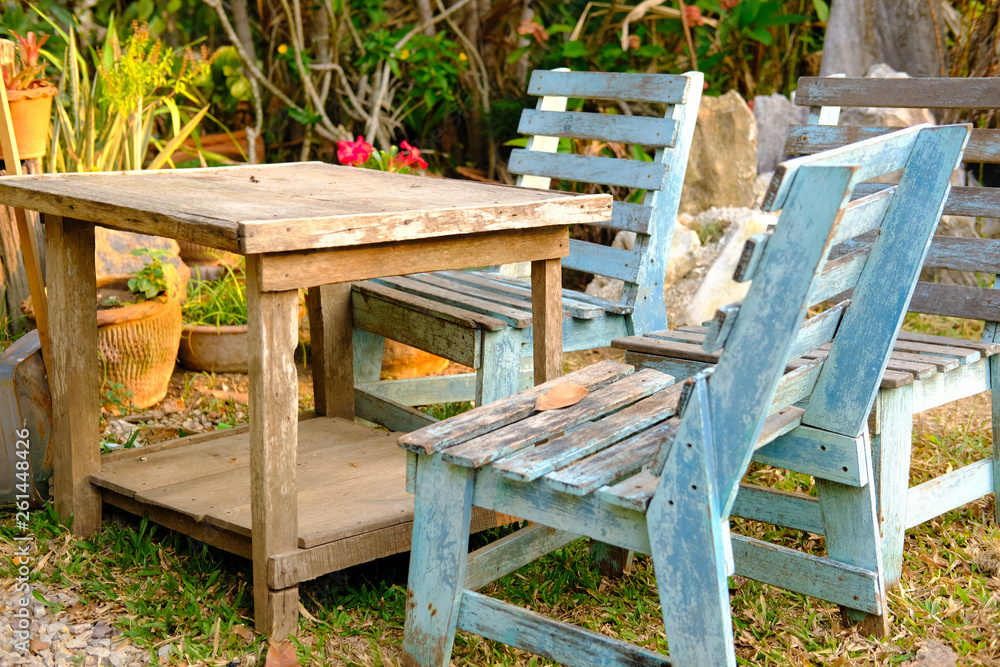old blue wooden chair table in garden