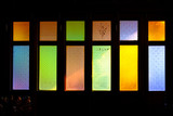 colorful stained glass window of wooden house