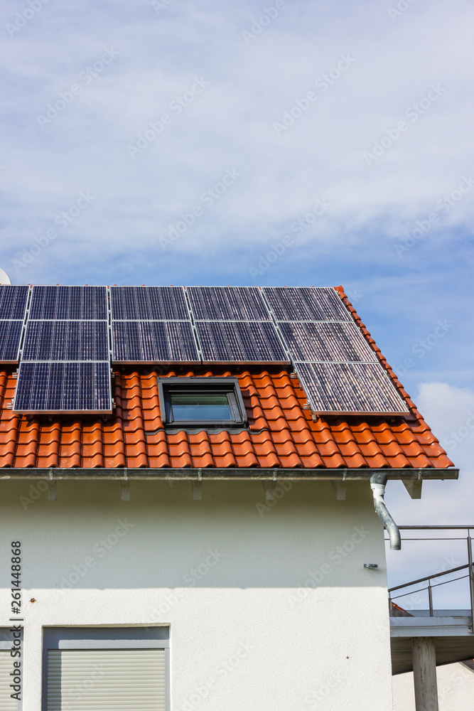 Fototapeta premium framing house with solar panels on rooftop