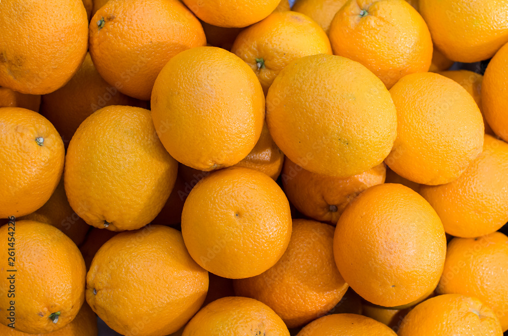 Fresh mandarin oranges texture. Tangerines as the background. Big bunch of ripe tangerines. Fresh oranges at a local farmers market. Fresh mandarin oranges texture. Tangerines as the background. Big bunch of ripe tangerines. Fresh oranges at a local farmers market.