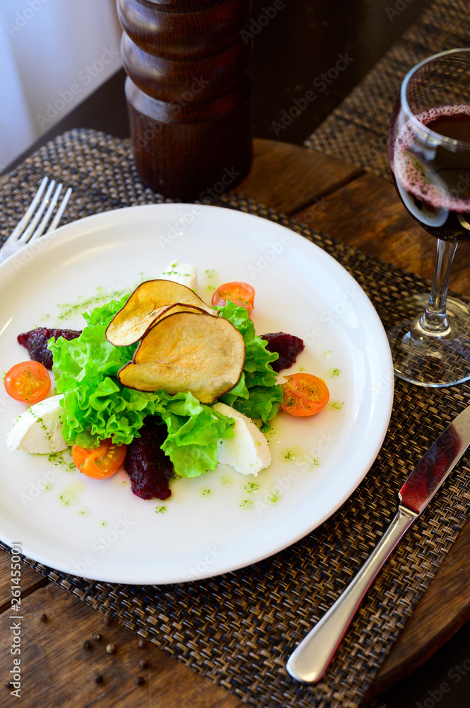 Salad with tomatoes, cheese, lettuce and beet Salad with tomatoes, cheese, lettuce and beet