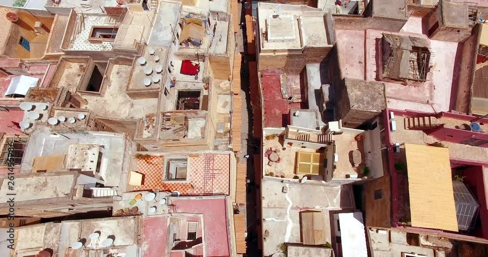 FEZ, MOROCCO. Aerial 4K drone view over the narrow streets of Fez. Awesomeness of Andalusian, Oriental and African style architecture. FEZ, MOROCCO. Aerial 4K drone view over the narrow streets of Fez. Awesomeness of Andalusian, Oriental and African style architecture.