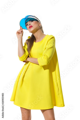 Fashion Model In Yellow Dress And Sun Visor