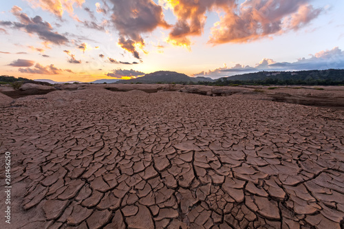 cracked earth near drying water on twilight at at Sam Pan Bok in Mekong river. Ubonratchathani Province ,Thailand