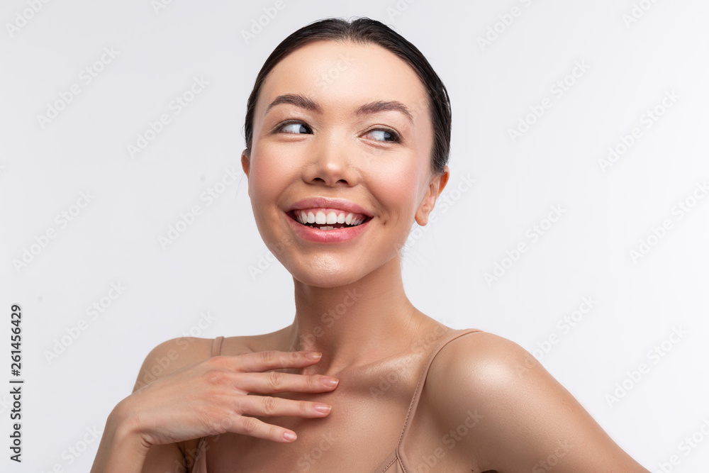 Dark-eyed beaming woman feeling excited and happy Dark-eyed beaming woman feeling excited and happy