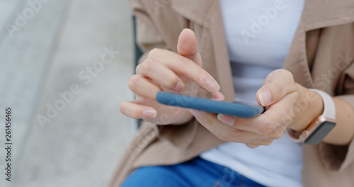 Woman use of mobile phone at outdoor district