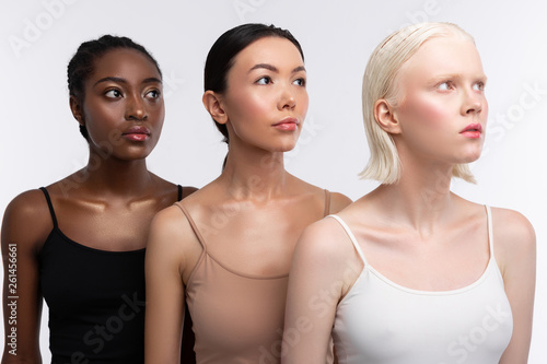 Fototapeta Three women with different skin color wearing camisoles