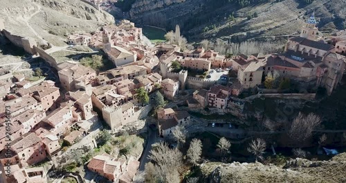 View from drone of Albarracin cityscape with ancient defensive walls and Cathedral tower, Aragon, Spain photo