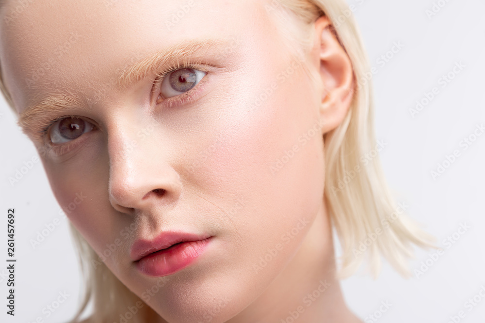 Beautiful young grey-eyed woman having light eyebrows Beautiful young grey-eyed woman having light eyebrows