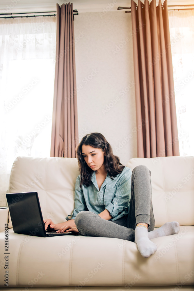 Bbeautiful woman using laptop computer at home on sofa Bbeautiful woman using laptop computer at home on sofa