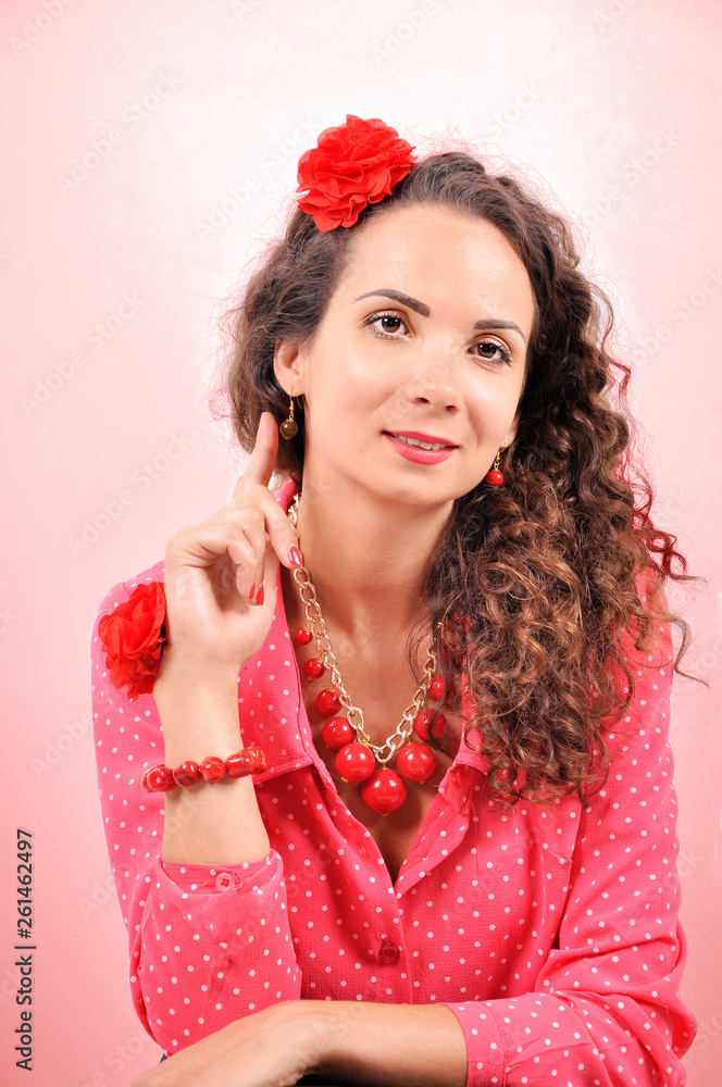 young girl with a red necklace, bracelet, hairpin on abstract background. young girl with a red necklace, bracelet, hairpin on abstract background.