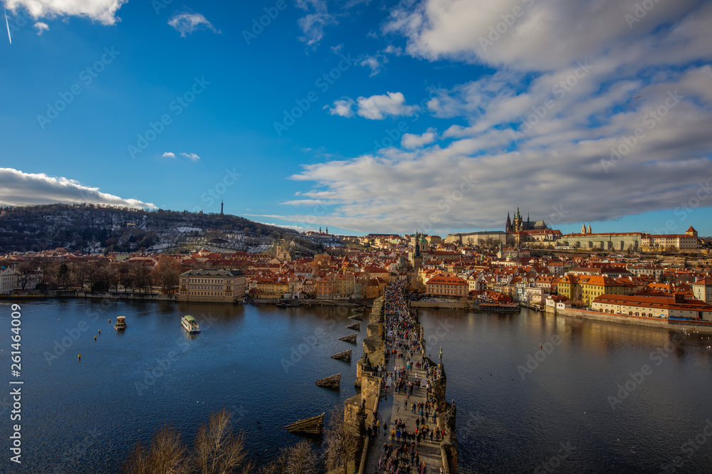 Prague city scape with castle and Charles Bridge over Vltava river