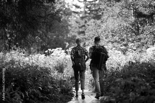 Couple walking in deep forest