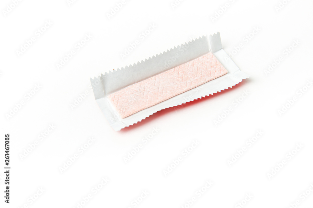 pastille of chewing gum in foil package on white background. pink chewing gum isolated on white background with copy space pastille of chewing gum in foil package on white background. pink chewing gum isolated on white background with copy space