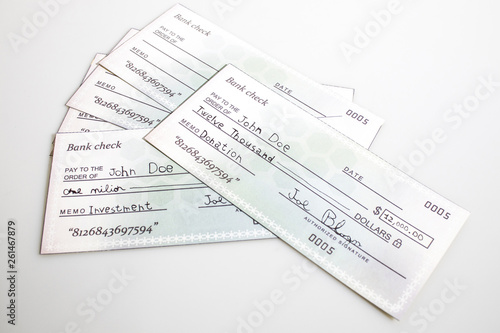 Many bank check isolated in a white background