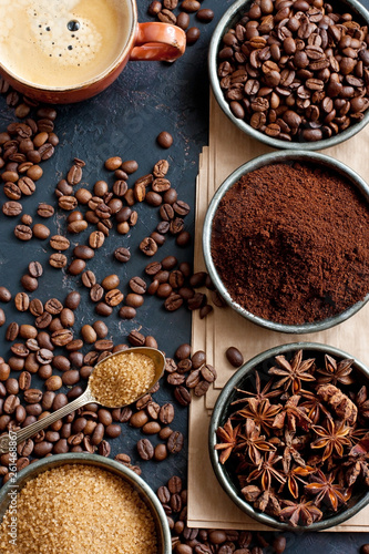 Assortment of coffee varieties on a black background. Top view. Free space for your text