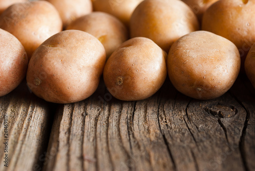 petite potatoes on rustic wood table background