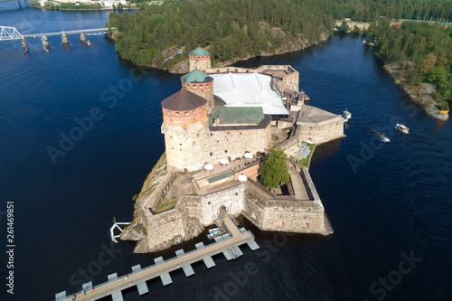 The ancient fortress of Olavinlinna on a sunny July day (aerial photography). Savonlinna, Finland photo