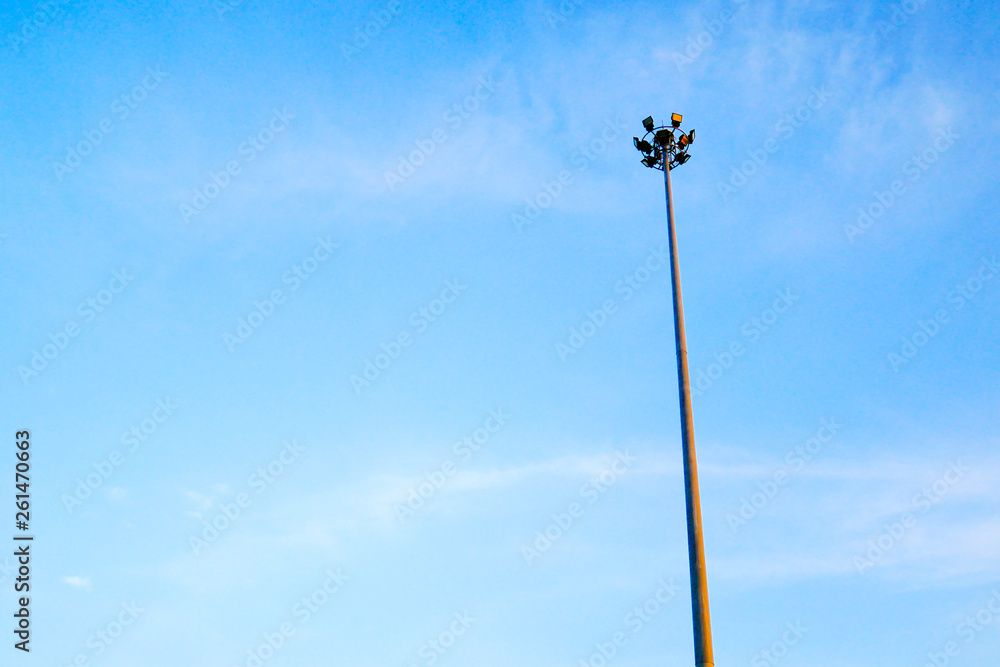 good view of the tall spotlight tower with blue and smooth sky good view of the tall spotlight tower with blue and smooth sky