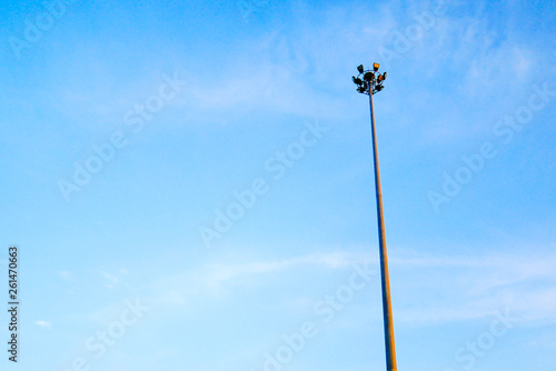 good view of the tall spotlight tower with blue and smooth sky