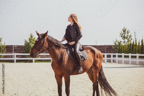Spring - summer season, concept of hobby, Woman with a horse on a nature, relationship human and animals 