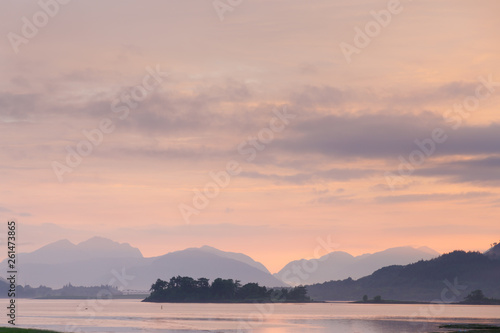 beautiful mystic sunset at glencoe and loch leven with fog and clouds