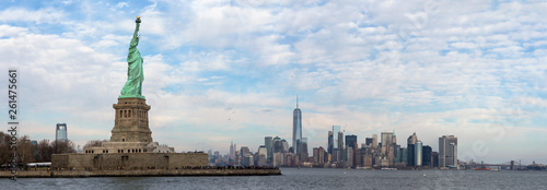 The skyline of New York City at daytime with the Statue Of Liberty National Monument in front. © Sebastian