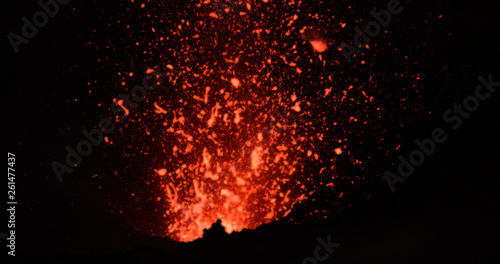 CLOSE UP: Dangerous chunks of searing hot magma comes flying out of volcano.