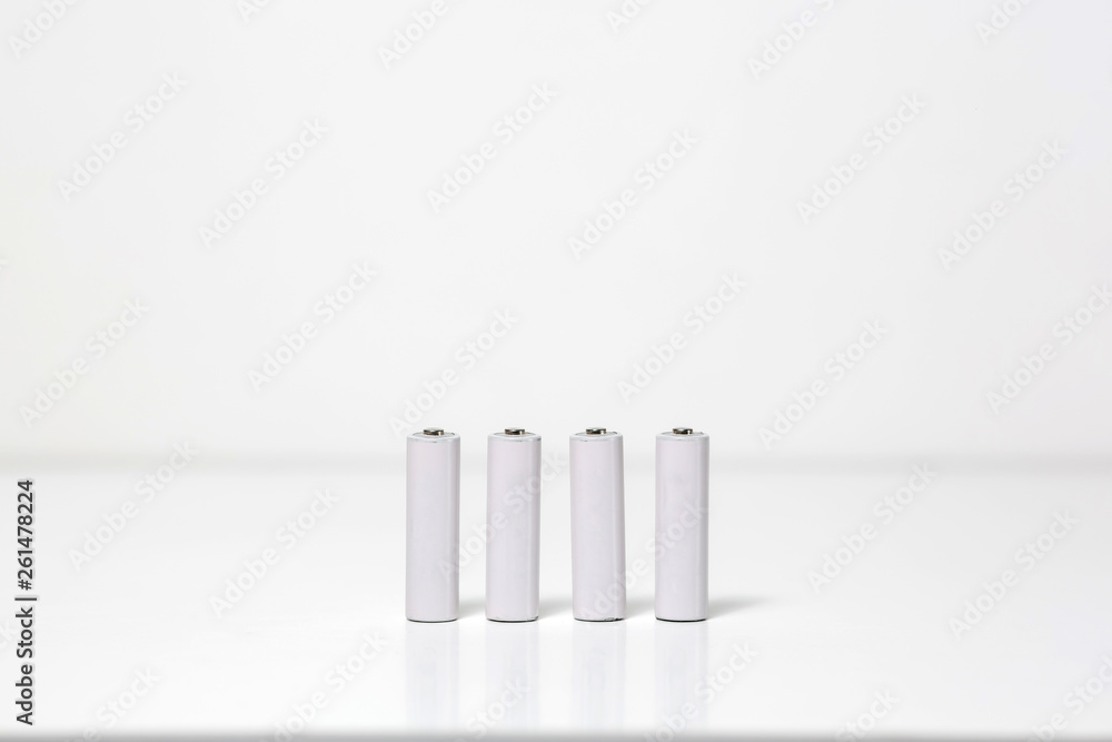 Small batteries. Clean white blank pattern is good for branding design. Background texture. Small batteries. Clean white blank pattern is good for branding design. Background texture.