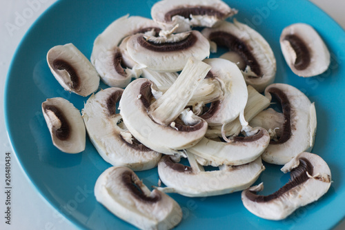 Champignon mushrooms fresh raw vegetarian food on table white background