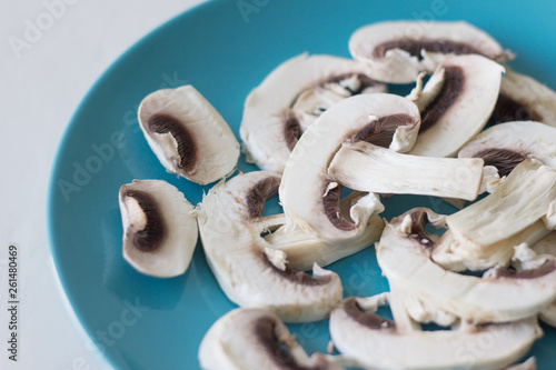 Champignon mushrooms fresh raw vegetarian food on table white background