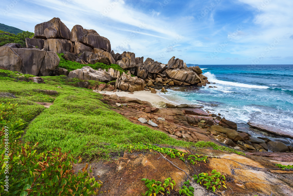 Rough and wild rocky coastline at anse songe, la digue, seychelles 10