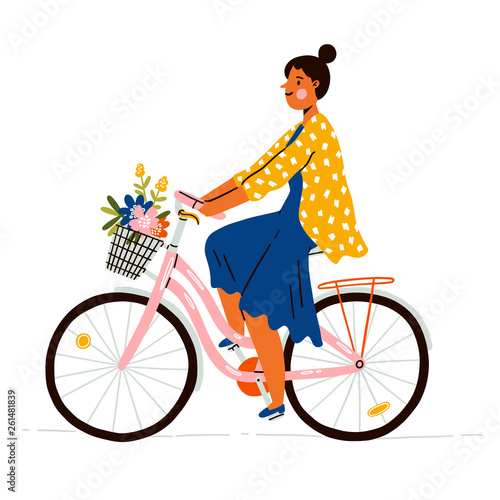 Girl on a bicycle with flowers