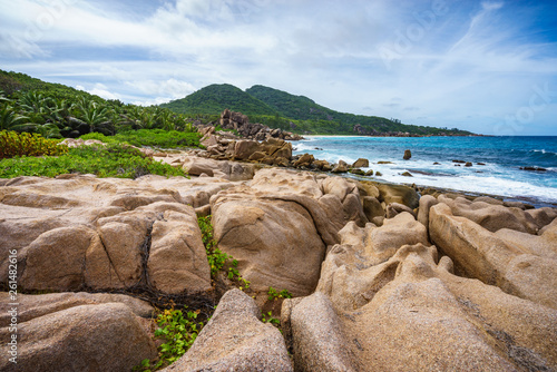 Rough and wild rocky coastline at anse songe, la digue, seychelles 36