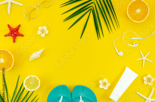 Summer vacantion flat lay frame on yellow background. Travel concept. Top view flat lay photo