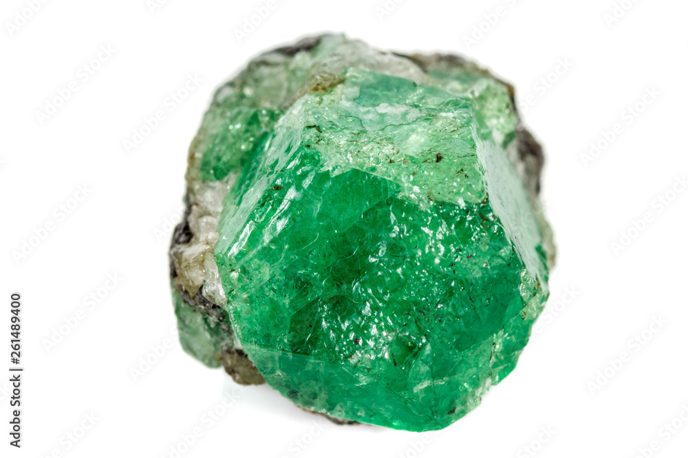 Macro stone garnet mineral, Uvarovite in rock on a white background Macro stone garnet mineral, Uvarovite in rock on a white background