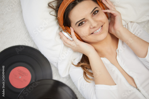 the image of resting sexy woman listening to vinyl