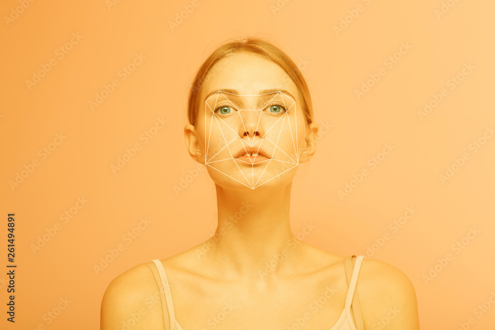 Facial recognition security system. Face augment mobile phone technology concept.