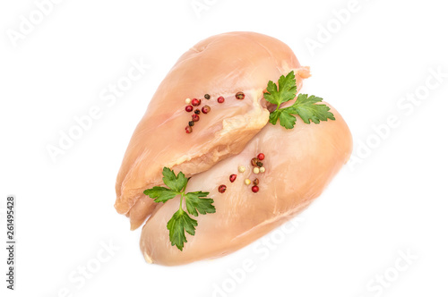 Raw chicken fillet with parsley and spices on white. Top view.