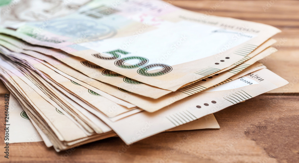 Heap of 500 hryvnia bills on wooden table. Close up. Heap of 500 hryvnia bills on wooden table. Close up.
