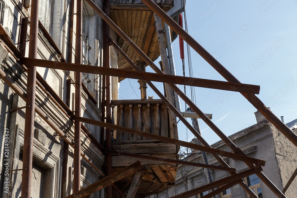 metal beams to strengthen the facade against the collapse of the old building in the historic center of Tbilisi in Georgia metal beams to strengthen the facade against the collapse of the old building in the historic center of Tbilisi in Georgia