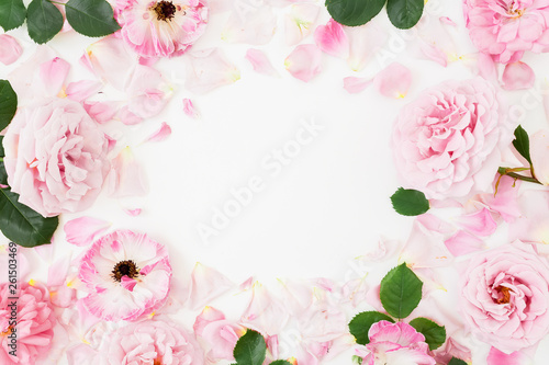 Frame composition of pink flowers on white background. Flat lay, Top view. Flowers texture.