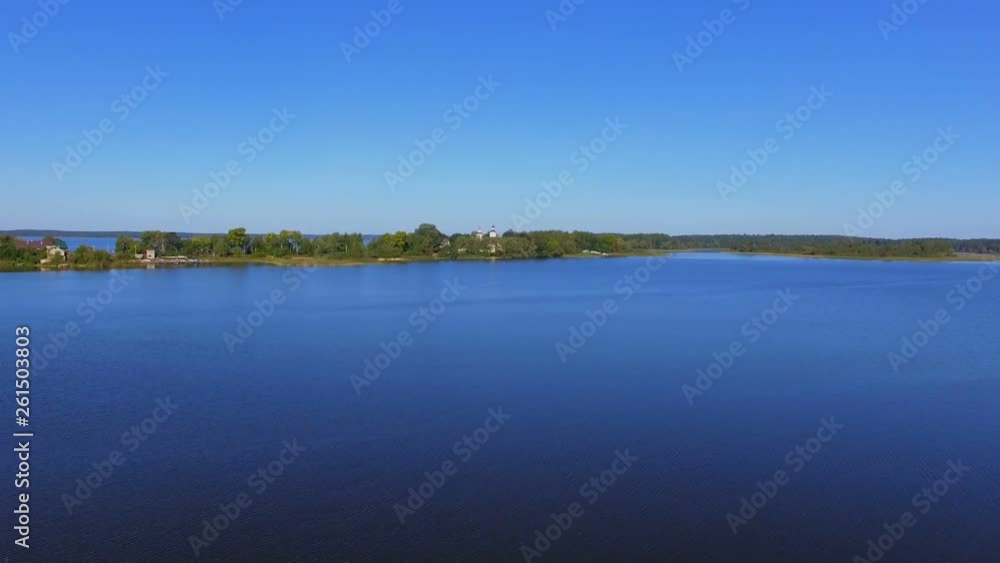 Aerial View Of Water Surface And Coast And Monastery On Lake Seliger, Russia Aerial View Of Water Surface And Coast And Monastery On Lake Seliger, Russia