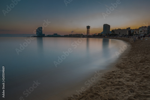 Scenic view of sand coast and calm sea, Barcelona, Spain