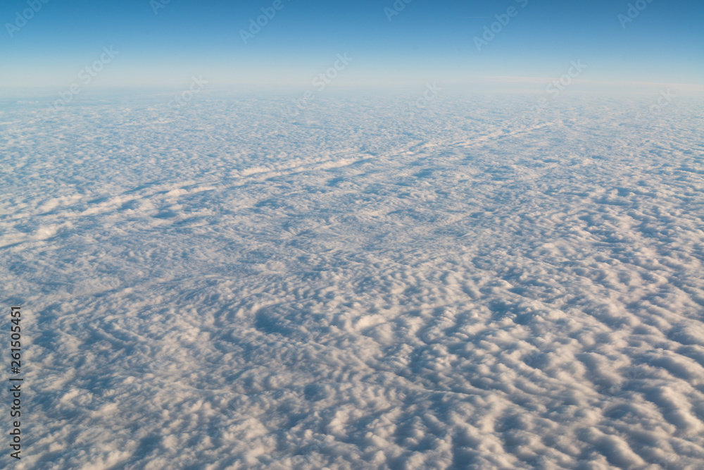 View from airplane on white thick clouds sky View from airplane on white thick clouds sky