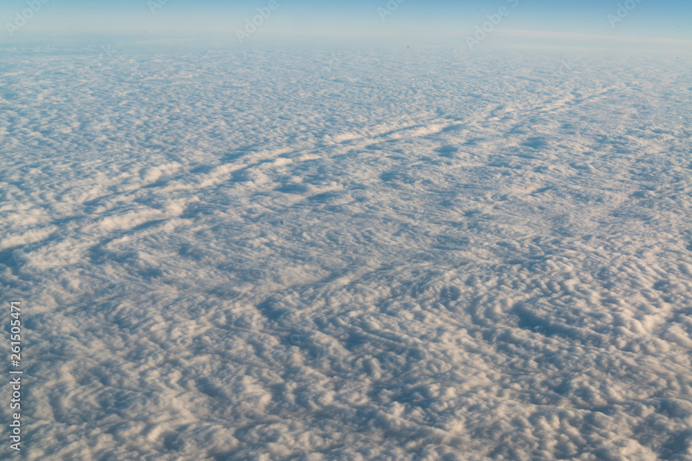 View from airplane on white thick clouds sky View from airplane on white thick clouds sky