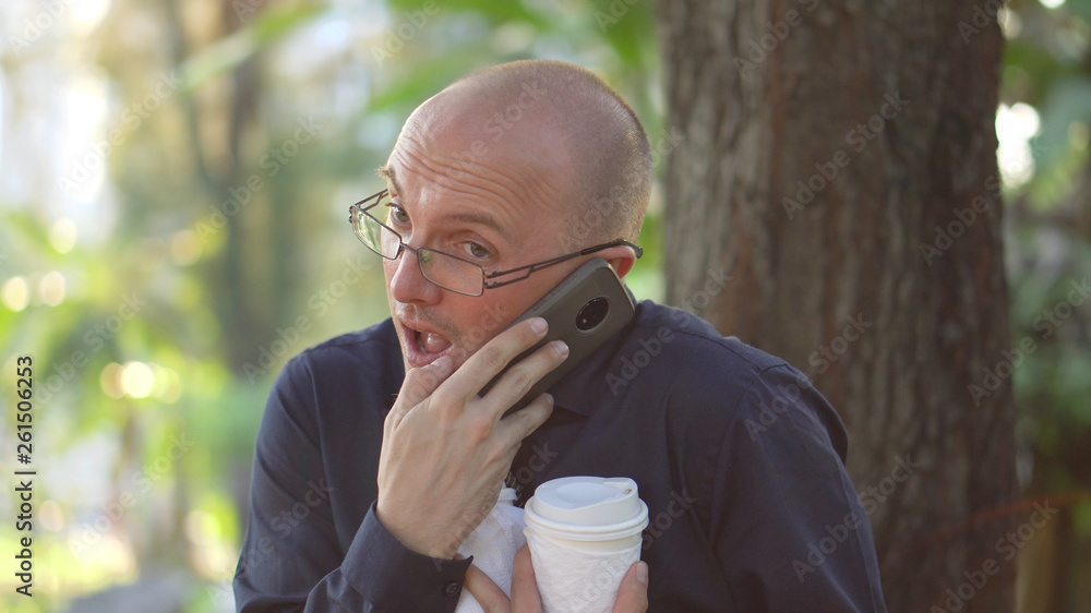 Overwhelmed Young High School Teacher Taking Call on Lunch Break Overwhelmed Young High School Teacher Taking Call on Lunch Break